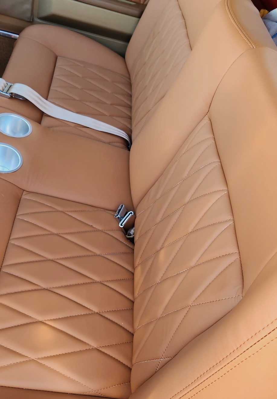 Detailed custom upholstered automotive seating; example of the shop's craftsmanship, not a Katzkin product photo